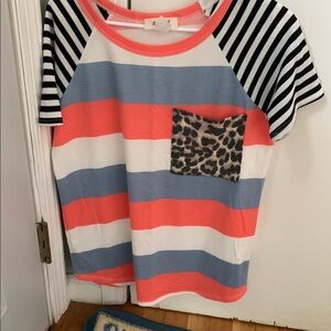 Vibrant Orange and Blue Short Sleeve Tee with Unique Patterns